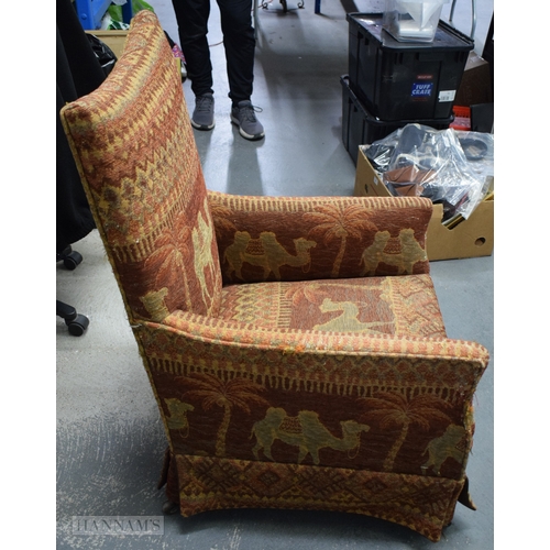 406 - AN UNUSUAL EARLY 20TH CENTURY COUNTRY HOUSE UPHOLSTERED DEEP CHAIR decorated with camels and Eastern... 