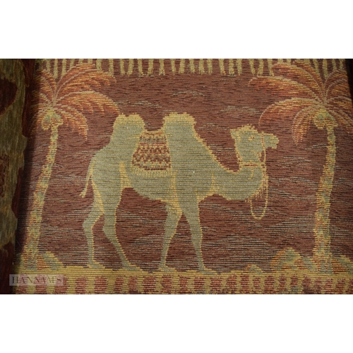 406 - AN UNUSUAL EARLY 20TH CENTURY COUNTRY HOUSE UPHOLSTERED DEEP CHAIR decorated with camels and Eastern... 