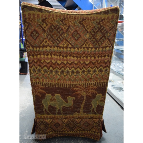 406 - AN UNUSUAL EARLY 20TH CENTURY COUNTRY HOUSE UPHOLSTERED DEEP CHAIR decorated with camels and Eastern... 