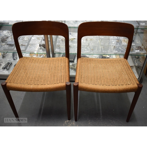 407 - A PAIR OF VINTAGE DANISH TEAK J L MOLLER CHAIRS with rattan seats. 74 cm x 42 cm.