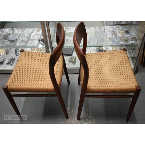 407 - A PAIR OF VINTAGE DANISH TEAK J L MOLLER CHAIRS with rattan seats. 74 cm x 42 cm.