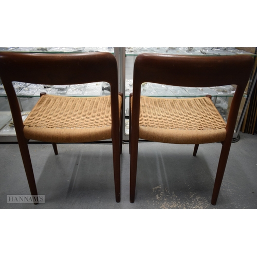 407 - A PAIR OF VINTAGE DANISH TEAK J L MOLLER CHAIRS with rattan seats. 74 cm x 42 cm.