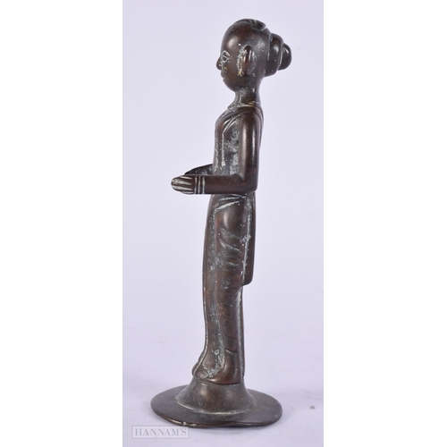 411 - AN EARLY INDIAN BRONZE FIGURE OF A HINDU DEITY. 14 cm high.