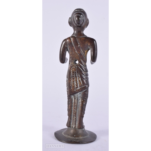 411 - AN EARLY INDIAN BRONZE FIGURE OF A HINDU DEITY. 14 cm high.