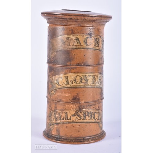 452 - AN ANTIQUE TREEN SPICE TOWER. 15 cm high.