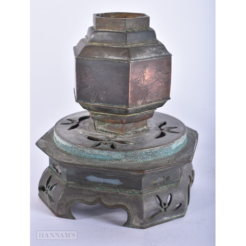 481 - A JAPANESE OIL LAMP with reticulated base. 17 cm high.