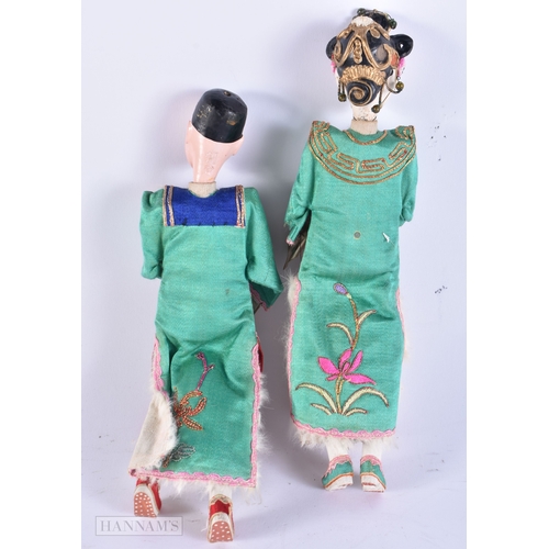 501 - A PAIR OF CHINESE REPUBLICAN PERIOD DOLLS together with a pair of Chinese wood panels. (4)