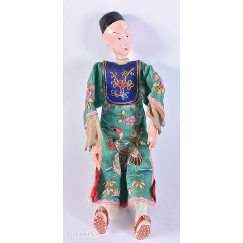 501 - A PAIR OF CHINESE REPUBLICAN PERIOD DOLLS together with a pair of Chinese wood panels. (4)