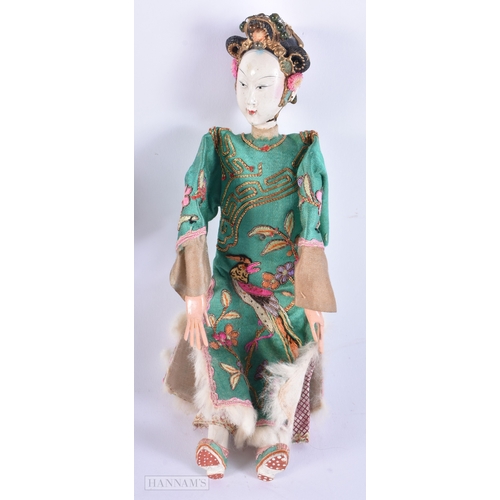 501 - A PAIR OF CHINESE REPUBLICAN PERIOD DOLLS together with a pair of Chinese wood panels. (4)