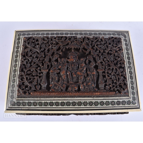 502 - A 19TH CENTURY ANGLO INDIAN CARVED SANDALWOOD CASKET decorated with figures. 24 cm x 14 cm.