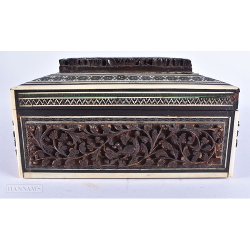 502 - A 19TH CENTURY ANGLO INDIAN CARVED SANDALWOOD CASKET decorated with figures. 24 cm x 14 cm.