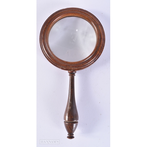 504 - AN ANTIQUE MAHOGANY MAGNIFYING GLASS. 20 cm long.