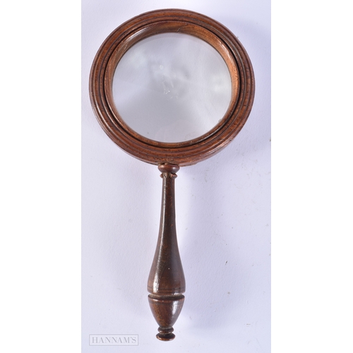 504 - AN ANTIQUE MAHOGANY MAGNIFYING GLASS. 20 cm long.