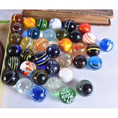 505 - ASSORTED MARBLES together with a book of military insignias. (qty)