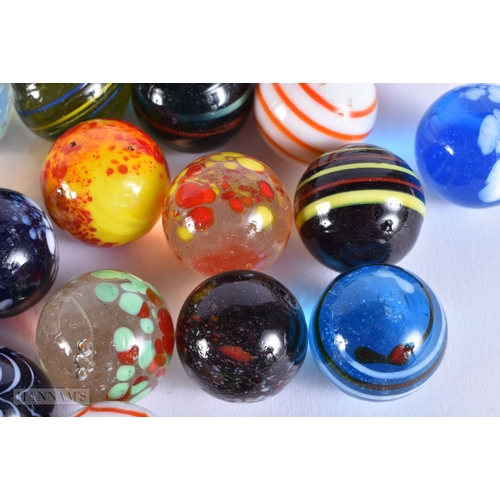 505 - ASSORTED MARBLES together with a book of military insignias. (qty)