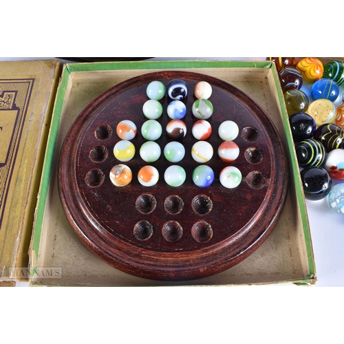 505 - ASSORTED MARBLES together with a book of military insignias. (qty)