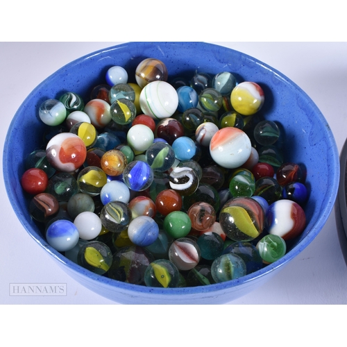 505 - ASSORTED MARBLES together with a book of military insignias. (qty)