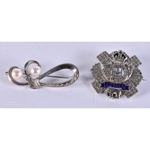 658 - TWO WHITE METAL BROOCHES. 13.2 grams. 2.75 cm x 2.75 cm. (2)