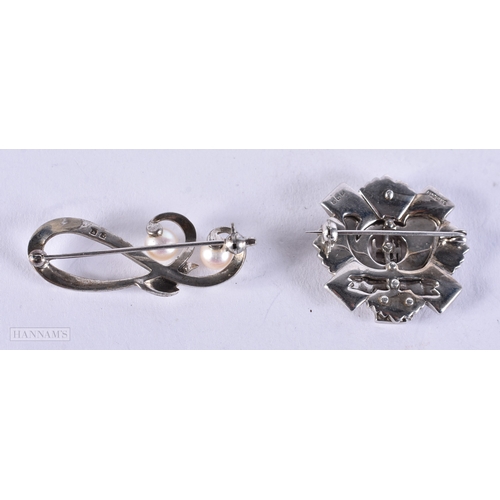 658 - TWO WHITE METAL BROOCHES. 13.2 grams. 2.75 cm x 2.75 cm. (2)