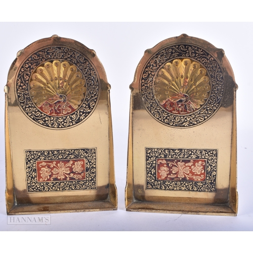 91 - A PAIR OF INDIAN ENAMELLED BRASS PEACOCK BOOKENDS. 15 cm x 9 cm.