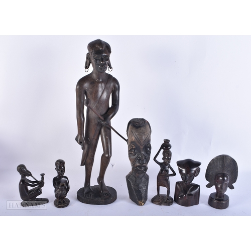 99 - A COLLECTION OF TRIBAL CARVED WOOD FIGURES. (qty)