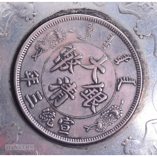 1788 - A PAIR OF CHINESE WHITE METAL COIN DISHES. 221.5 grams. 9.25cm diameter.