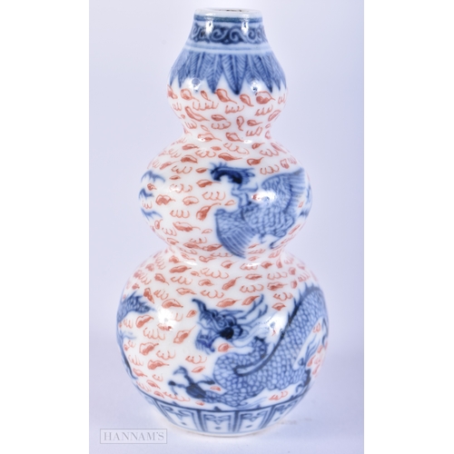 2004 - A FINE 19TH CENTURY CHINESE TRIPLE GOURD PORCELAIN SNUFF BOTTLE Qing, painted with dragons and phoen... 