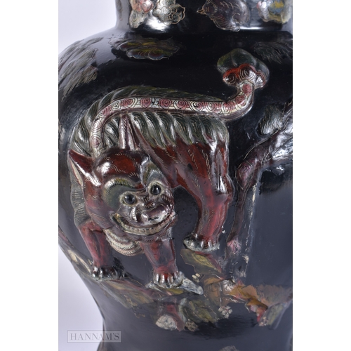 2027 - A VERY RARE 18TH/19TH CENTURY CHINESE BLACK LACQUER VASE AND COVER Qing, decorated in relief with a ... 