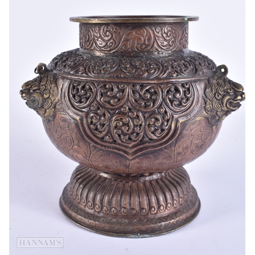 2060 - AN 18TH/19TH CENTURY TIBETAN COPPER REPOUSSE RETICULATED CENSER decorated with foliage and mask head... 