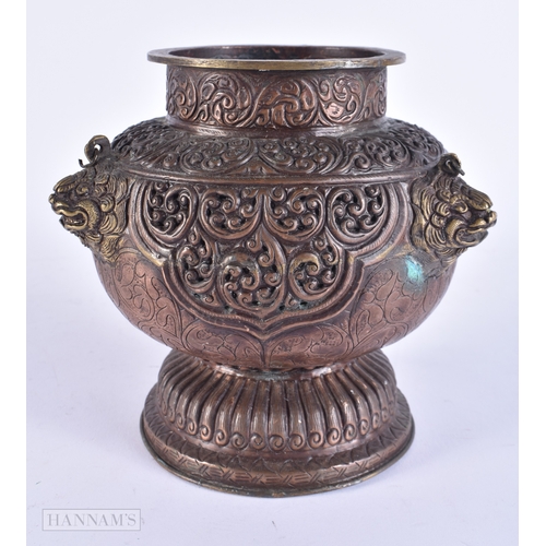 2060 - AN 18TH/19TH CENTURY TIBETAN COPPER REPOUSSE RETICULATED CENSER decorated with foliage and mask head... 