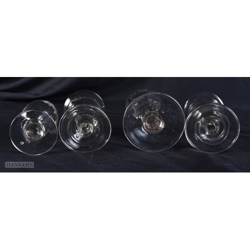 100 - FOUR ANTIQUE GLASSES one engraved with a motto and  birds. Largest 13 cm high. (4)