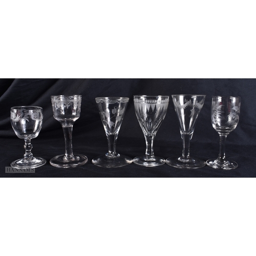 101 - SIX ANTIQUE GLASSES all engraved with flowers. 12 cm high. (6)