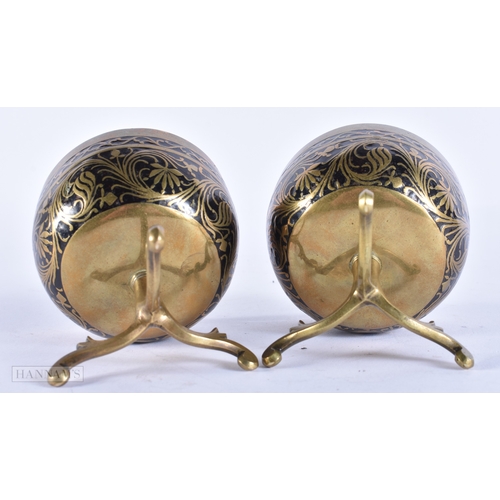 107 - A PAIR OF 19TH CENTURY INDIAN BRONZE MOUNTED COCONUT BOWLS. 8.5 cm x 8.5 cm.