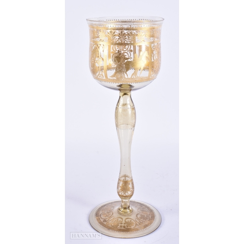 111 - AN UNUSUAL ANTIQUE GILDED GLASS GOBLET decorated with classical chariot scenes. 30 cm high.