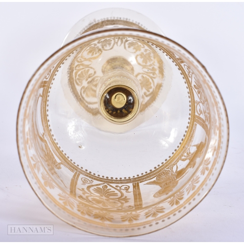 111 - AN UNUSUAL ANTIQUE GILDED GLASS GOBLET decorated with classical chariot scenes. 30 cm high.