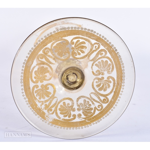 111 - AN UNUSUAL ANTIQUE GILDED GLASS GOBLET decorated with classical chariot scenes. 30 cm high.