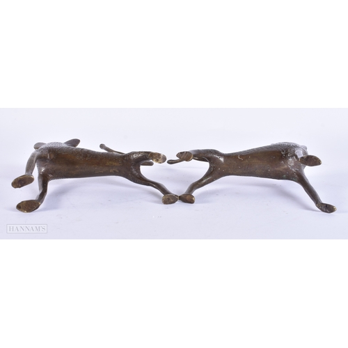 117 - A PAIR OF ANTIQUE AFRICAN BRONZE WOLVES. 15 cm wide.