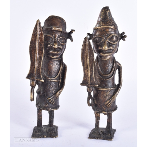 119 - A PAIR OF 19TH CENTURY AFRICAN BENIN BRONZE TRIBAL FIGURES. 21 cm high.