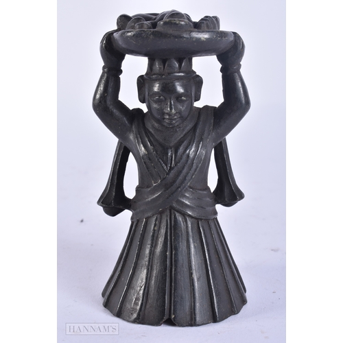 121 - A RARE 18TH/19TH CENTURY INDIAN CARVED STONE DEITY modelled holding aloft a basket inset with a figu... 