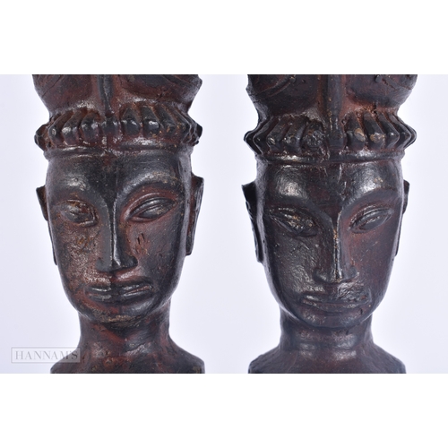 124 - AN UNUSUAL PAIR OF 19TH CENTURY ASIAN EASTERN BRONZE DEITIES modelled with hands clasped. 23 cm high... 