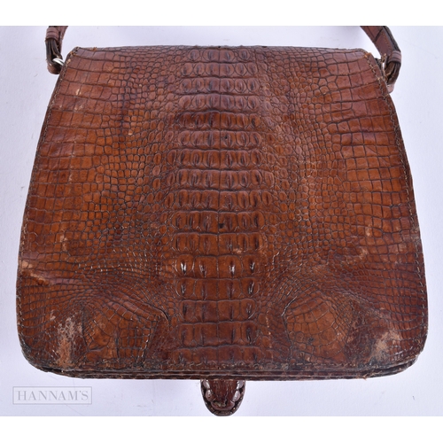 128 - A CHARMING EDWARDIAN NOVELTY BABY ALLIGATOR LEATHER SKIN BAG with glass eyes. 15 cm x 15 cm excludin... 