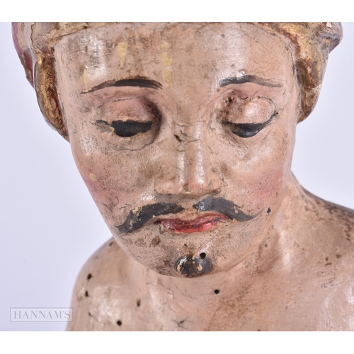 130 - AN UNUSUAL 17TH/18TH CENTURY EUROPEAN PAINTED WOOD FIGURE OF A MALE possibly representing an Eastern... 