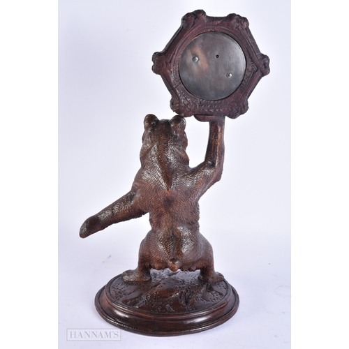 132 - A RARE 19TH CENTURY BAVARIAN BLACK FOREST CARVED WOOD BAROMETER formed as a standing bear. 42 cm x 1... 