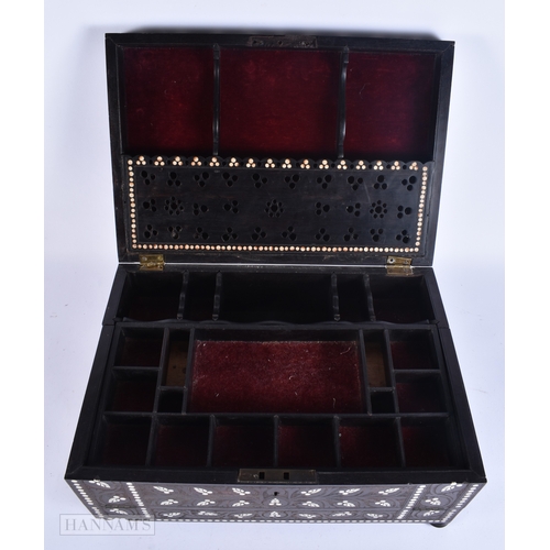 133 - A VERY LARGE LATE 19TH CENTURY ANGLO INDIAN CARVED WOOD JEWELLERY BOX inlaid with motifs and flowers... 