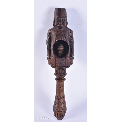137 - A 19TH CENTURY BAVARIAN CARVED WOOD TREEN NUTCRACKER. 23 cm high.