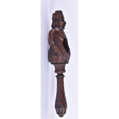 137 - A 19TH CENTURY BAVARIAN CARVED WOOD TREEN NUTCRACKER. 23 cm high.