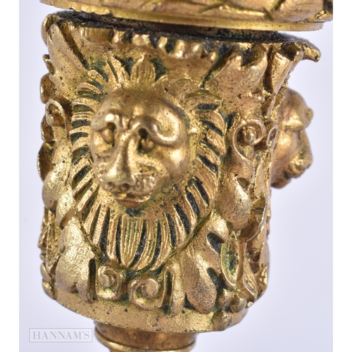 143 - A PAIR OF 19TH CENTURY FRENCH ORMOLU CANDLESTICKS formed with lion and ram mask heads. 20 cm high.