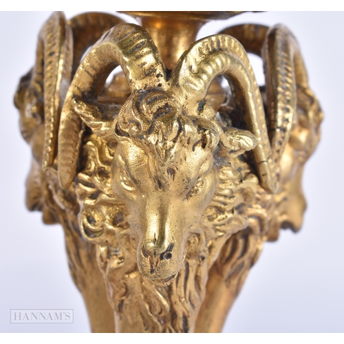 143 - A PAIR OF 19TH CENTURY FRENCH ORMOLU CANDLESTICKS formed with lion and ram mask heads. 20 cm high.