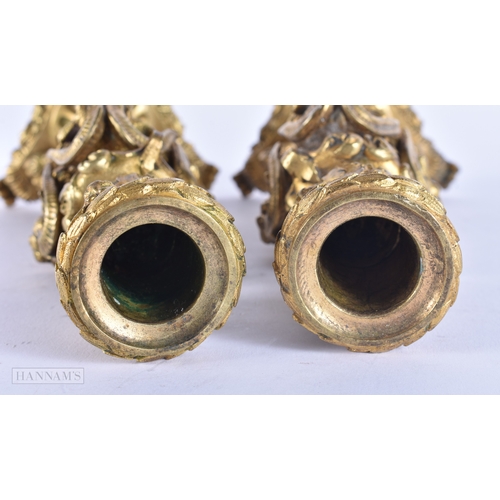 143 - A PAIR OF 19TH CENTURY FRENCH ORMOLU CANDLESTICKS formed with lion and ram mask heads. 20 cm high.