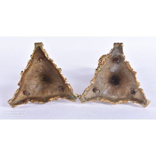 143 - A PAIR OF 19TH CENTURY FRENCH ORMOLU CANDLESTICKS formed with lion and ram mask heads. 20 cm high.